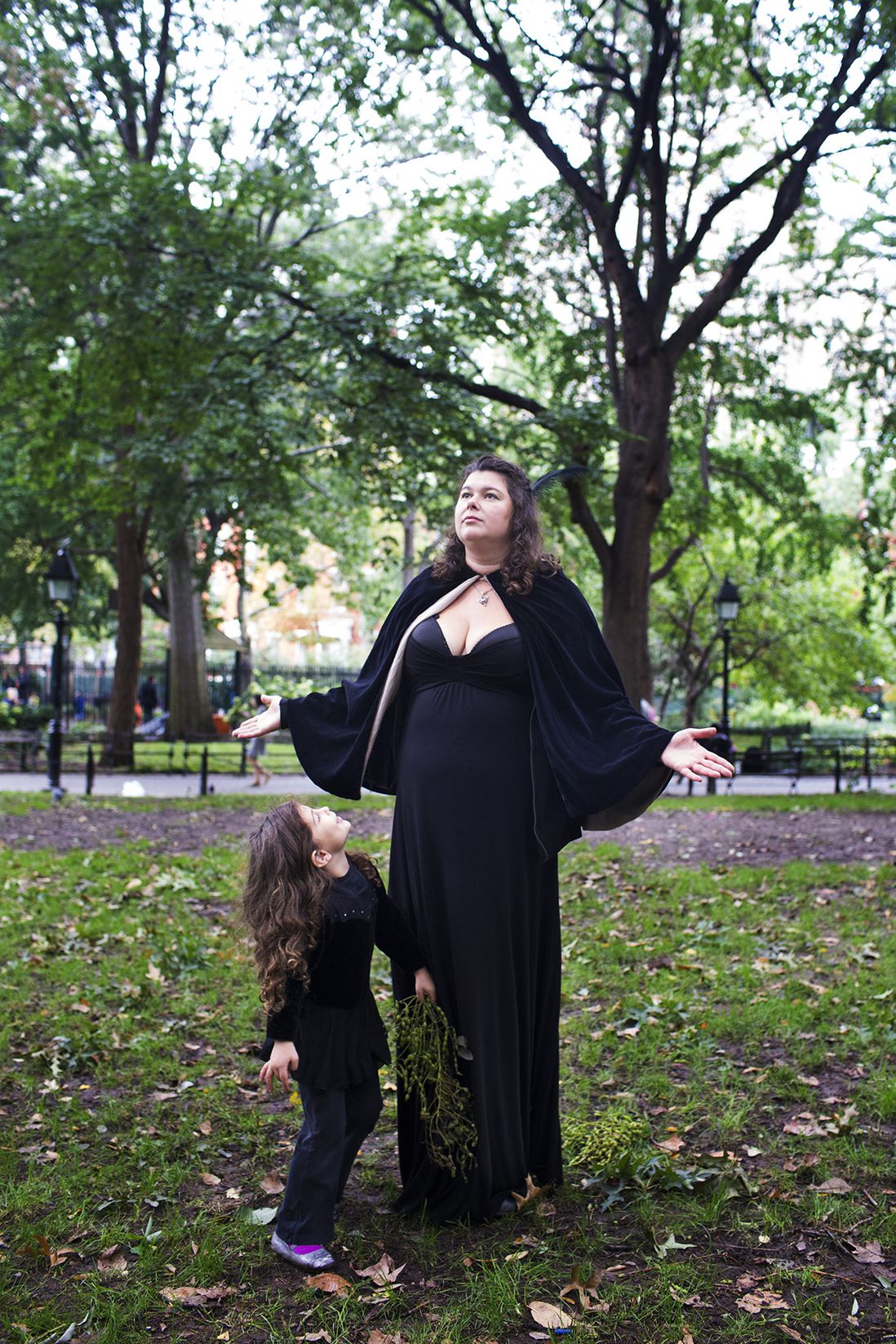 Anna Lewis plays with her daughter Maya Cousineau, 5, in Washington Square Park during the Pagan Pride Festival on Saturday, October 1, 2016. Lewis says, "I don&#8217;t really care if they (my children) are practicing Pagans later on but... I want them to feel apart of the earth and that they are important members of it."<br>